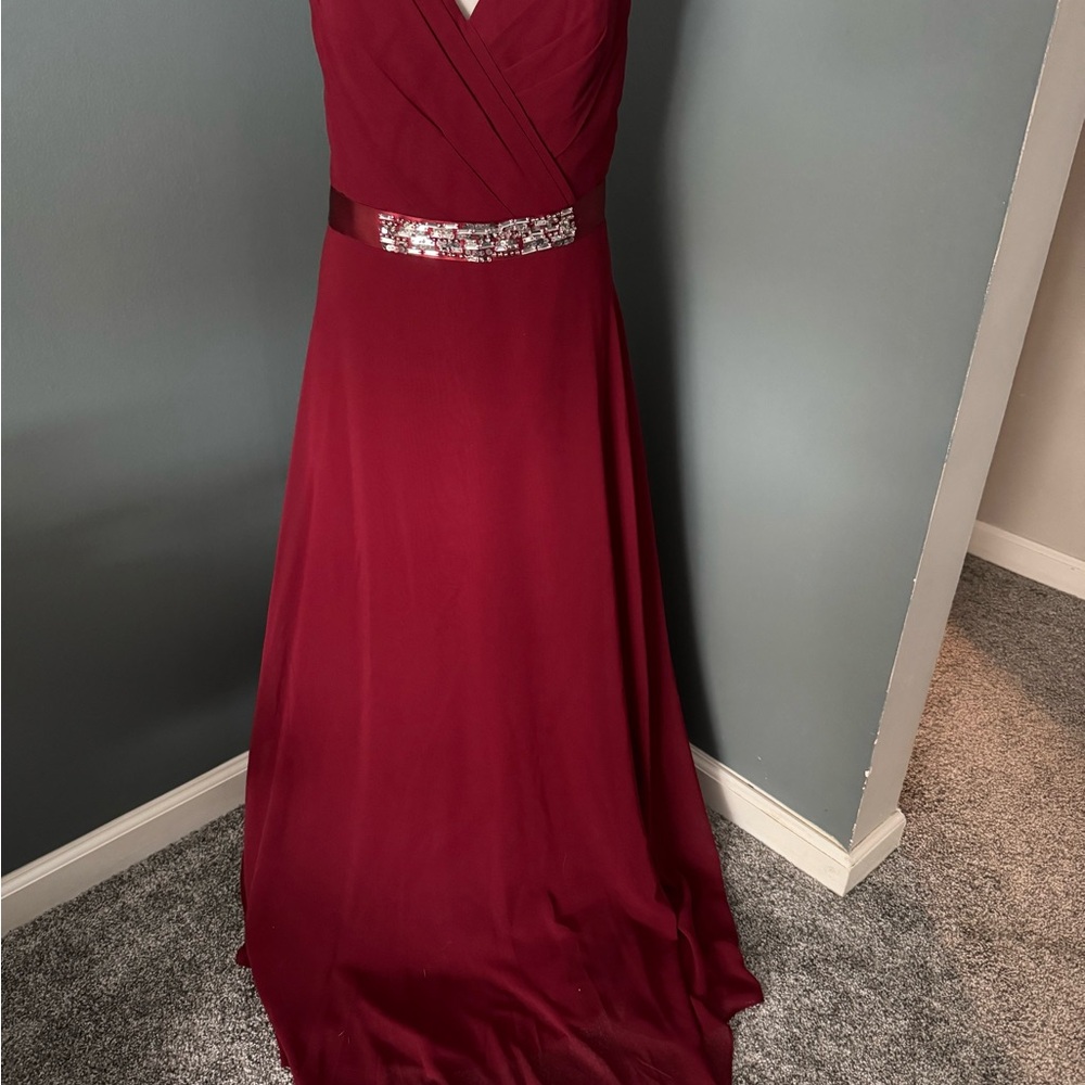 Burgundy/rust color bridesmaid formal spaghetti strap gown.